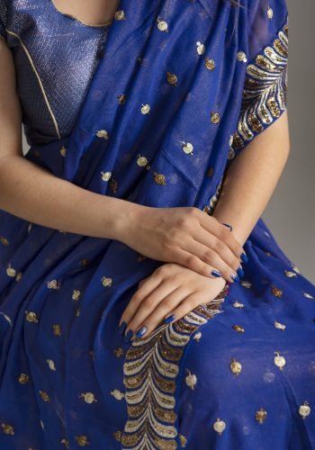 close up hands woman wearing traditional sari garment
